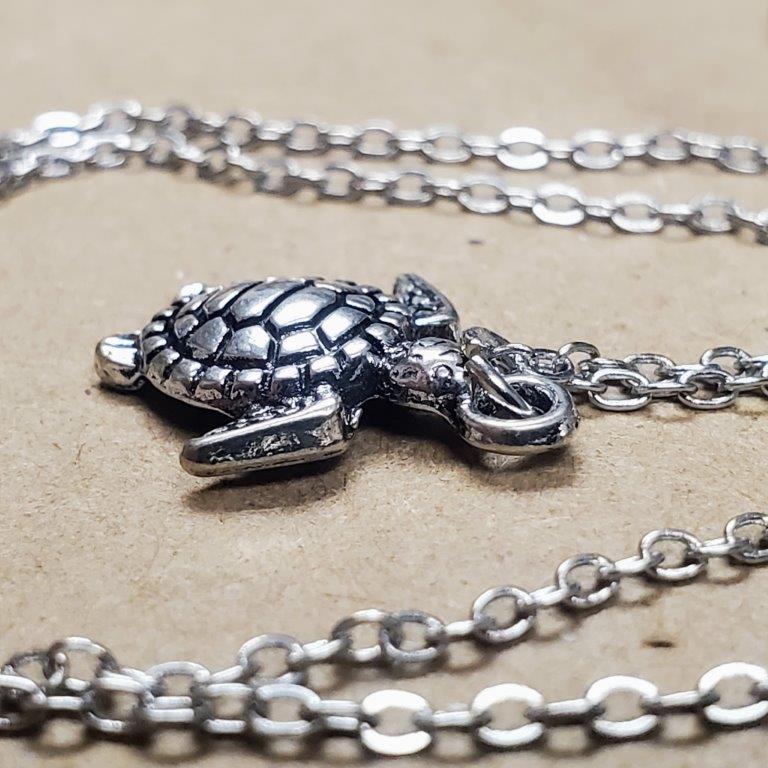 1/10 CT. T.W. Diamond Motherly Love Turtles Pendant in Sterling Silver and  10K Rose Gold | Zales